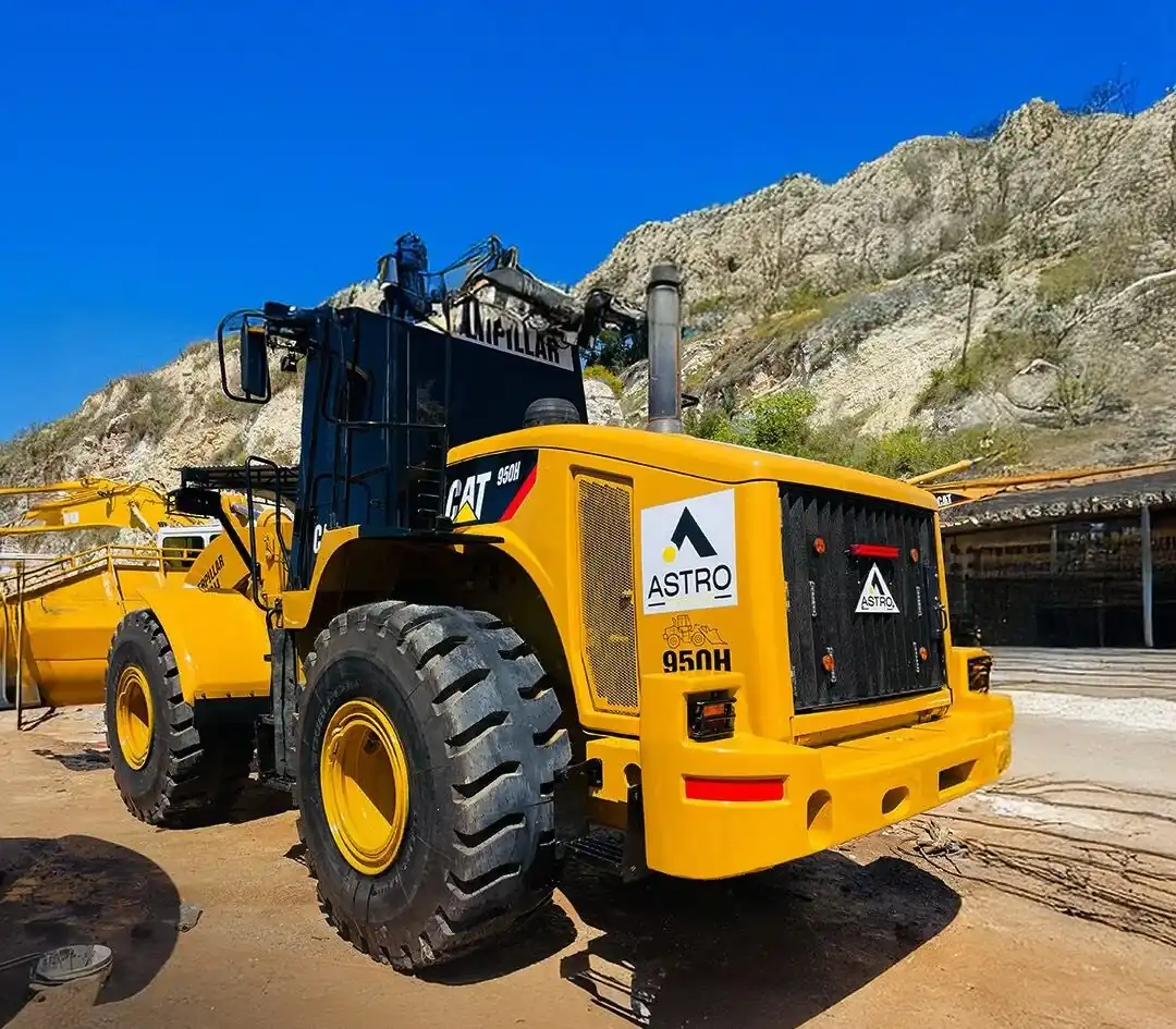 Astro Cables logo on a CAT 950H construction loader.