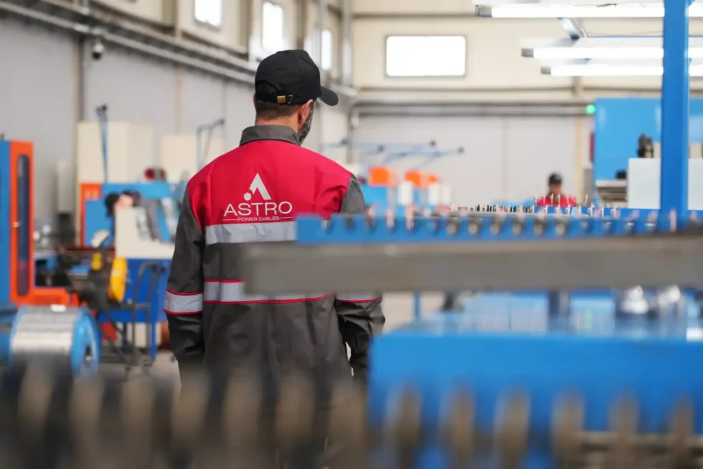 Astro Cables worker inspecting production line at the factory.