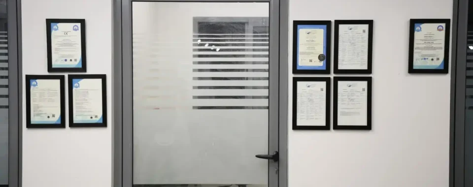 ISO certifications displayed on the wall at Astro Cables.