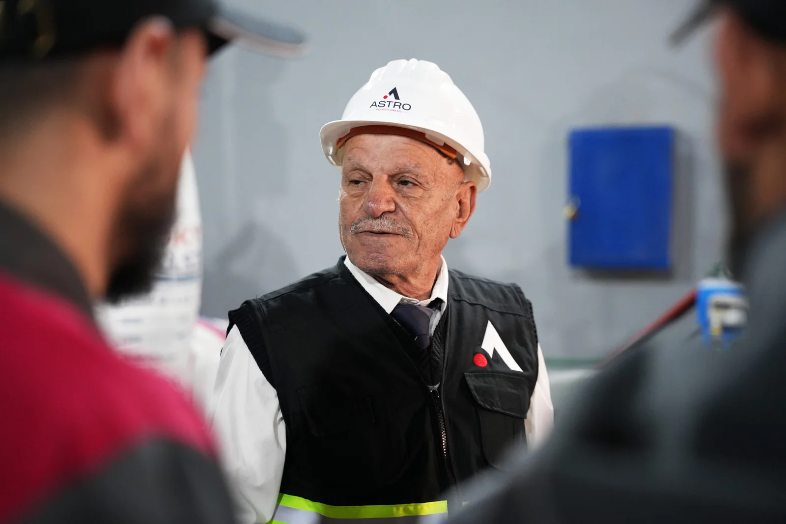 Astro Cables team leader wearing safety gear in the factory.